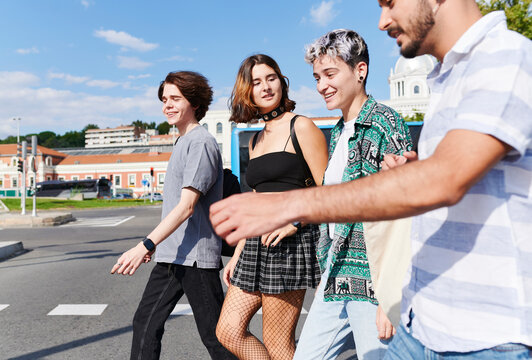 Diverse lgbt friends walking in the city  
