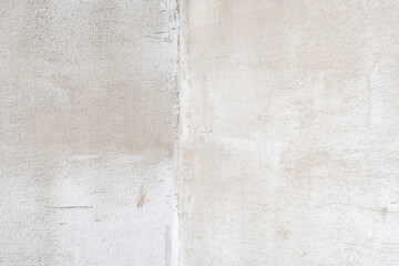 Background with a concrete wall with a fine texture in a house under construction.