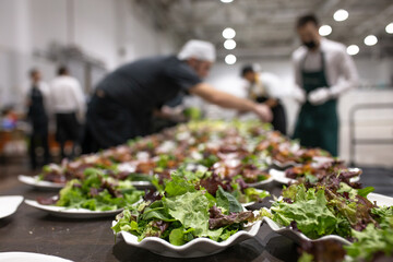 the chef prepares dishes for the banquet