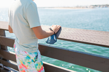Boy holding mask looking at the beach