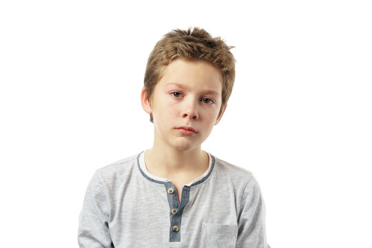 portrait of a sad boy isolated on white background.