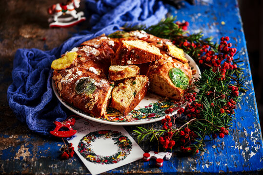 Bolo Rei .Traditional Portuguese Christmas cake on a Christmas rustic background