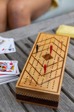 Young Girl Playing Cribbage on Coffee table 