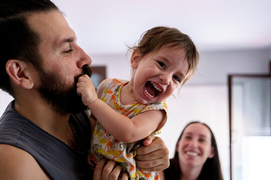 Baby pulling his dad's beard