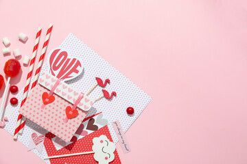 Valentine's Day accessories on pink background, space for text