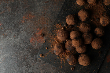 Concept of sweets with truffles on dark textured background