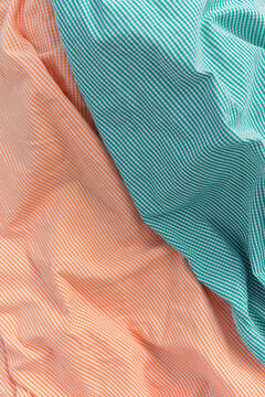 Orange and mint checkered shirts.