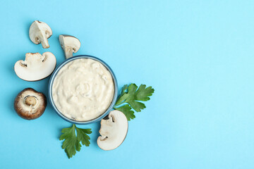 Concept of tasty food with mushroom sauce on blue background
