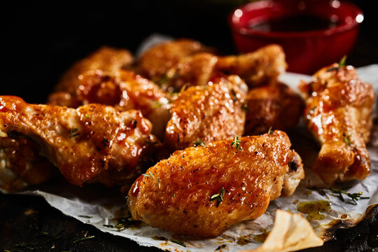 Appetizing chicken wings on table