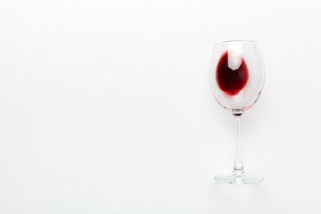 One glasses of red wine at wine tasting. Concept of red wine on colored background. Top view, flat lay design