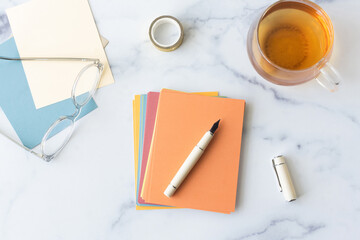 Pen and blank cards on table
