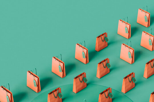 pink shopping bags in rows with a copy space