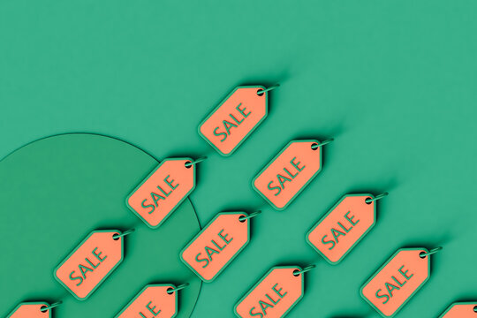 overhead shot of pink sale tags with copy space
