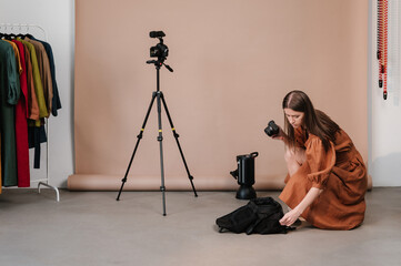 Photographer in showroom with clothes