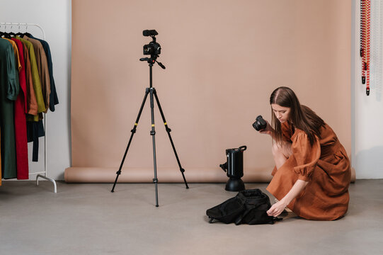 Photographer in showroom with clothes
