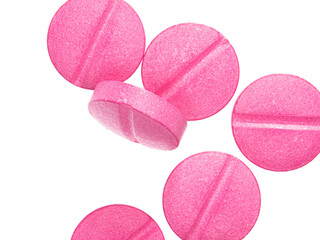 Pink pills isolate on white background