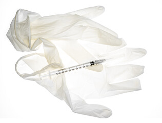 Used latex glove transparent on white background