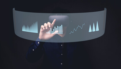Businessman using Virtual Reality Metaverse glasses to virtual world showing bar graph business growth