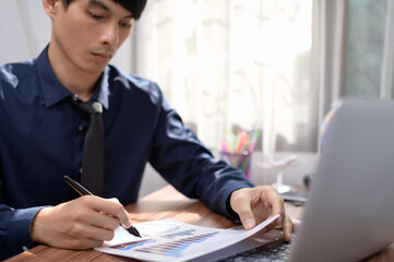 businessman writing documents signing documents