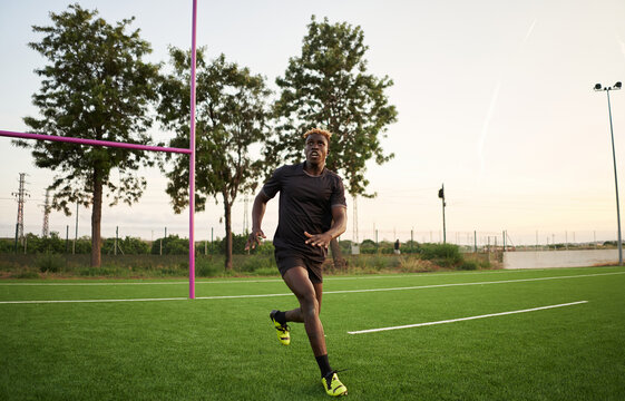 Black rugby player training on field