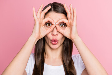 Portrait of attractive cheerful girl showing double ok-sign looking specs pout lips isolated over pink pastel color background