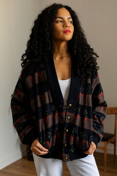 Latina woman with vintage cardigan