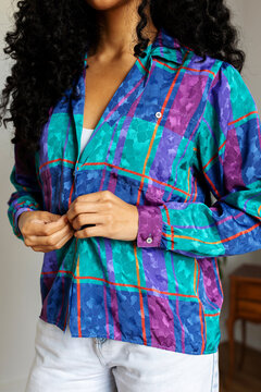 Model buttoning vintage shirt