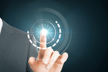 Close up of businessman hand using abstract round interface on blue background. HUD, click, push screen and technology concept.