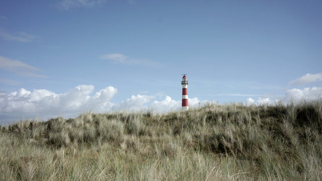 Lighthouse tower behing the dunes
