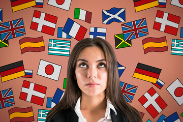 Portrait of attractive young european businesswoman with abstract colorful flag drawings. Travel, translation and language learning concept. © Who is Danny
