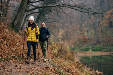 Happy husband and wife, slowly finishing the hiking marathon, to