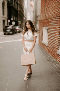 A Woman Shopping In A Big City