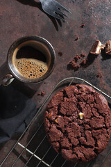 Large chocolate cookie and coffee