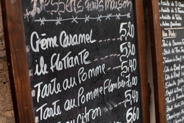 dessert menu on blackboard in restaurant in France
