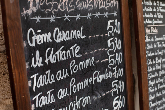dessert menu on blackboard in restaurant in France