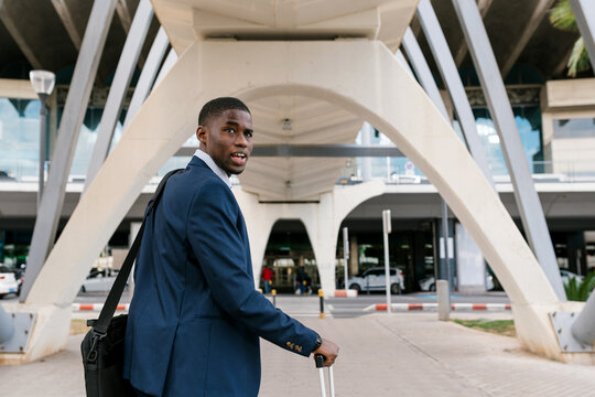 Young businessman arriving at the airport