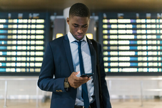 African businessman browsing the smart phone