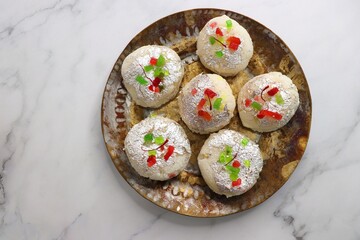 Rasmalai or Malai Sandwich, Roshmolai, Rasamalei is very popular Indian dessert. A sweet malai stuffing inside Rasgulla. It's a sweet delicacy made with Indian cottage cheese or chenna. Copy space.