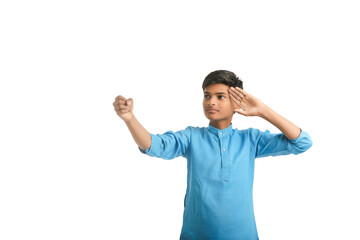 Fototapeta premium Indian boy in traditional wear and giving hand expression on white background.
