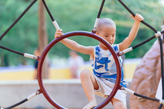 boy practicing climbing 