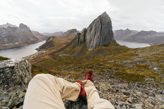 Faceless traveler admiring Segla Peak