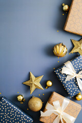Blue Christmas vertical background with gift boxes, golden stars, balls. Xmas greeting card design