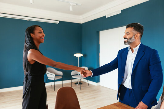 Diverse notaries shaking hands