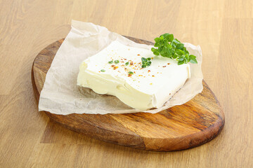 Greek Feta cheese over board