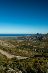 Fototapeta na wymiar Winding mountain road between Pego village and Vall d'Ebo, Marina Alta, Costa Blanca, Alicante Province, Spain