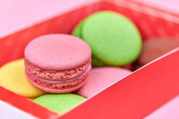 Set of bright cookies in a paper box.