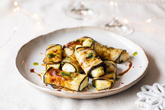 Vegetarian canapes of halloumi cheese wrapped in grilled aubergine