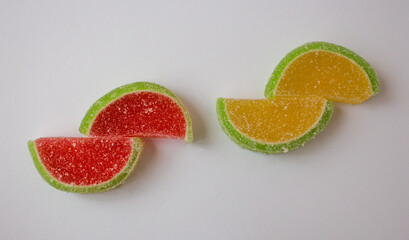 Fototapeta na wymiar isolated bright fruit marmalade with sugar on white background