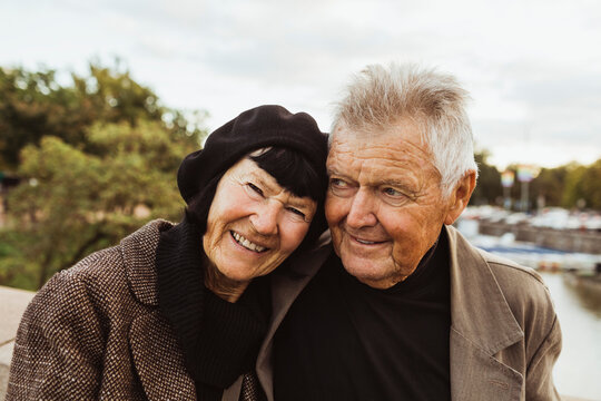 Portrait of smiling senior woman with man during vacation