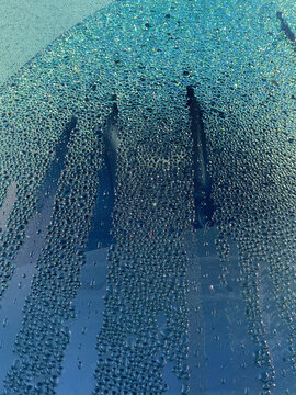 condensed waterdrops on glass of car windshield
